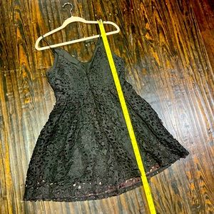 Black A-line filigree appliqué dress with mauve accents